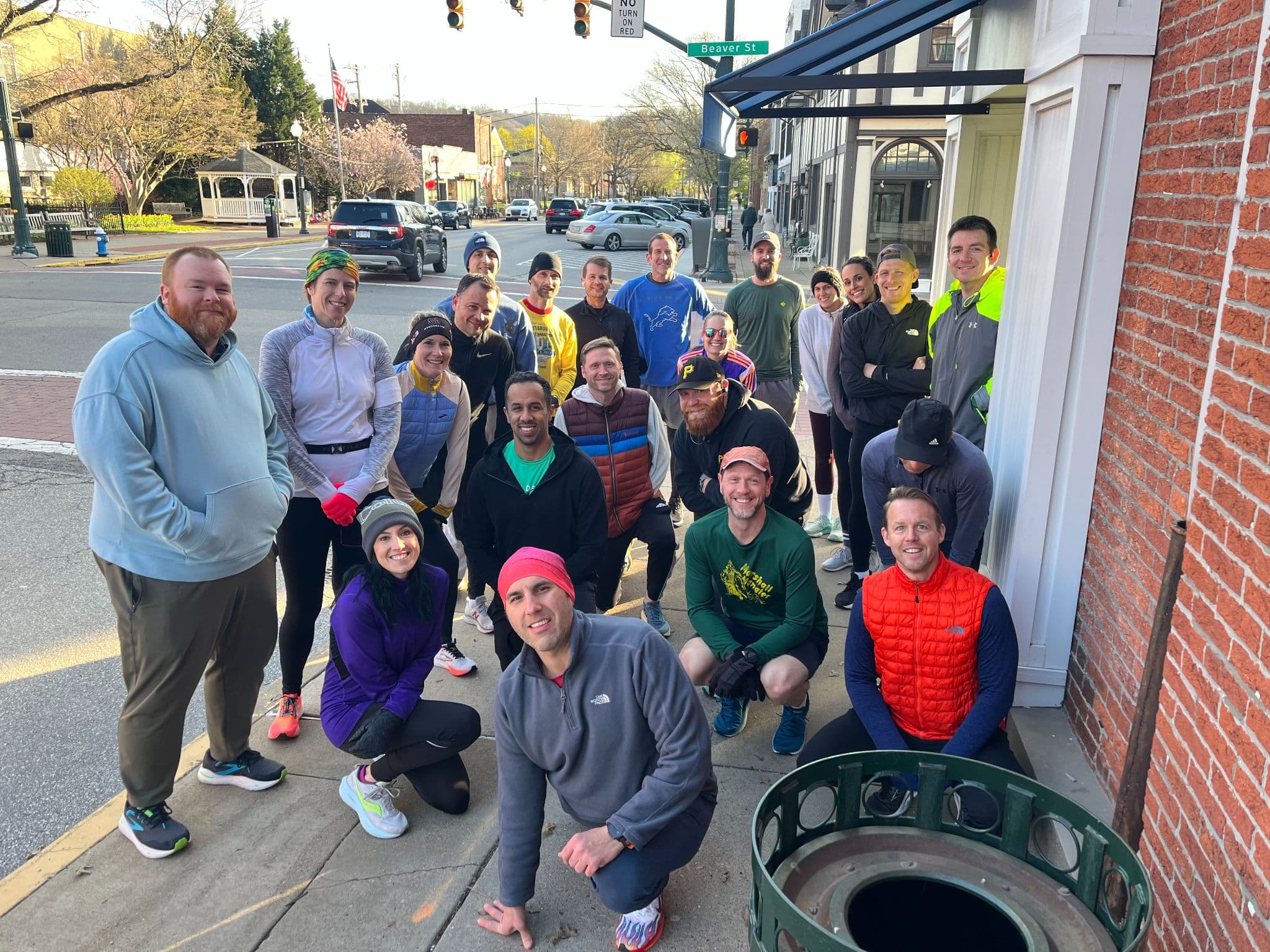 Sewickley Run Club members at the corner of Broad and Beaver before an early spring run
