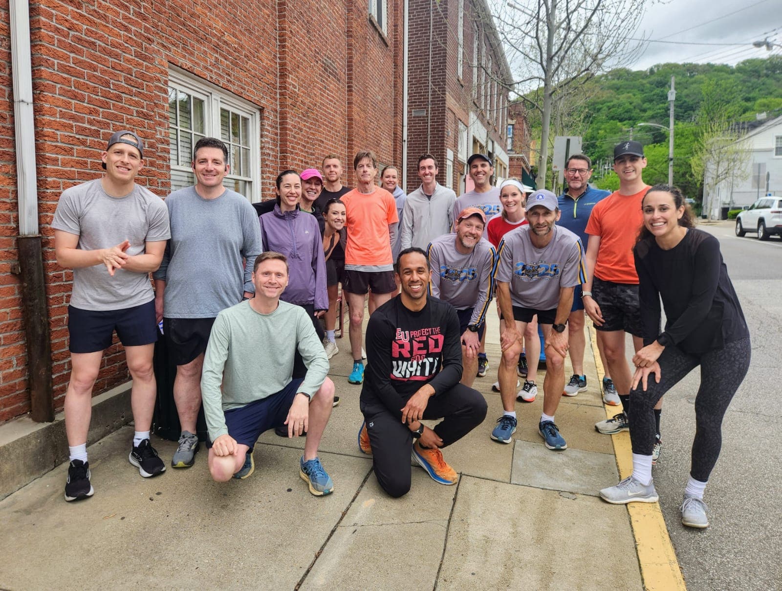 Sewickley Run Club members gathered before the start of a spring race